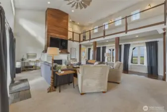 Upper walkway connects both ends of house and opens to expansive Living Area