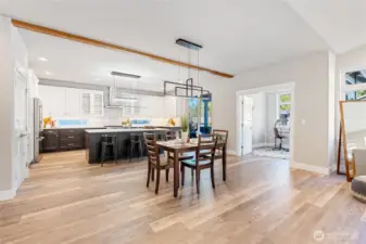 Amazing flow in this floorplan! You have a large dining area right off of the kitchen, which also flows into a private office dividable by French doors, and a covered outdoor living space right off of the kitchen.