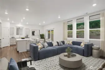 Big great room that can accommodate three couches and lots of room for relaxing together. Photo is representational. Actual home is under construction. Colors, materials, and features may vary. See site agent for details.