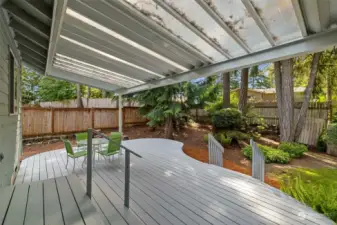 You will love the use this large, covered deck, a space that can be used all year long. The backyard is a lush private space.