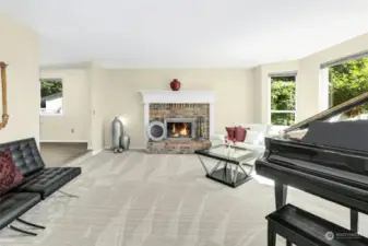 Formal living room with brand new carpeting and wood burning fireplace.