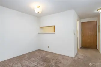 Dining area, with hallway and front door on the right