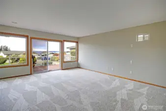 Generous primary suite with views and deck access.