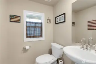 Half bath at the bottom of the stairs.