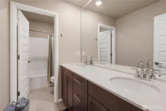 Large upstairs bathroom with modern finishes.