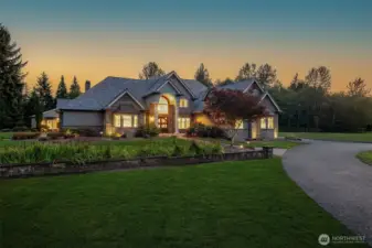 The main home. East facing with a Davinci Roof set to last FOREVER! The lawn has been enhanced digitally to showcase and add to the beauty.