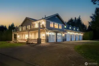 Gorgeous cobblestone driveway leads to this massive shop attached to a 2 bedroom, one bath penthouse with elevator and 2 bay, tandem garage with office space, kitchenette and bathroom.