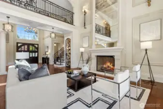 The main residence showcases bespoke craftsmanship, stately columns that exude elegance, wrought iron rails that reveal the living room below and soaring ceilings that evoke a sense of grandeur.