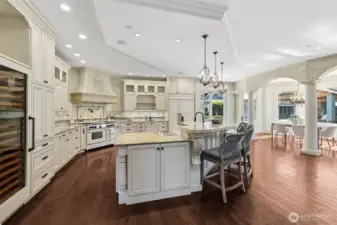 Wine fridge large enough for the wine enthusiast! Ready to serve your guests. Just around the corner, down the hall is a butlers pantry w commercial coffee machine and the main floor laundry room.