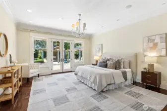 This primary bedroom is huge and and accesses the heated back patio and courtyard.