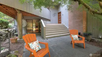 Inviting outdoor seating area at the private entry, perfect for morning coffee or evening unwinding.