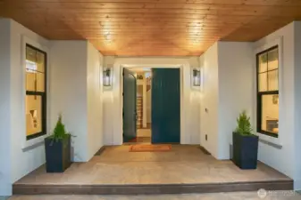 This beautiful covered entry way leads the stunning double front doors. It also gives you a sneak peek at that open staircase!