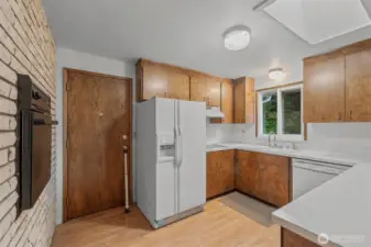 kitchen looking at side door to large deck