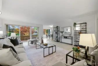 Enjoy an open, airy layout as the large living room transitions into a spacious dining area accented by beautiful tile flooring.