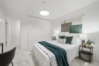 Comfortable bedroom features a generous closet with built-in organizers to maximize storage and style.