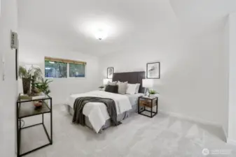 Step into the roomy primary bedroom, a serene space perfect for rest and relaxation.