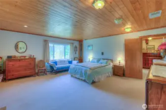 Primary bedroom upstairs is spacious and overlooks the orchard area.