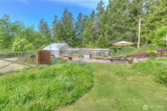 Picnic area off the stone patio and green house.