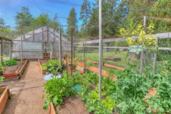 Lush garden space and greenhouse will keep you stocked up all year.