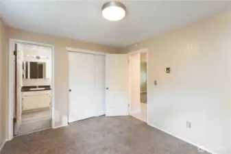 Primary bedroom looking to full bathroom