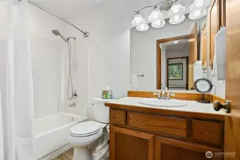 Guest full bathroom on upper level.