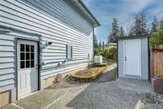 Side yard with storage shed.