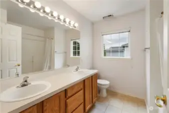 Large guest bathroom located between the two bedrooms on the second floor also has dual vanities to make prep easier!