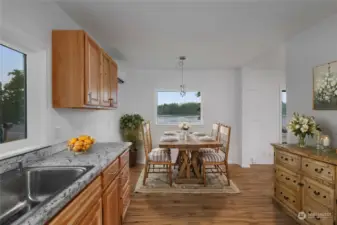 Kitchen and virtually staged dining room. All new!