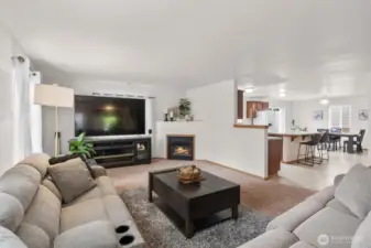 Another shot of the living room and kitchen