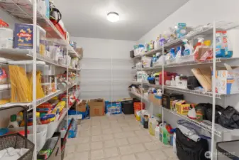 Expansive pantry!  Pantry leads to the large 2 car garage.  Also being used partially as a mudroom for shoes, backpacks, coats on the way in the door.