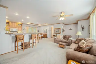 Open space living expands into the dining and kitchen areas.