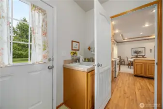 Easy access and could serve as a mud room, notice the utility sink also in the Laundry room.