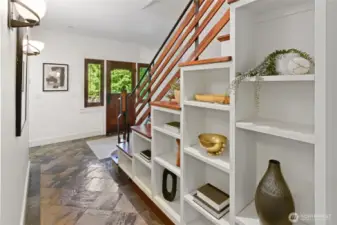 Lovely built-in shelving follow the lines of the stairway