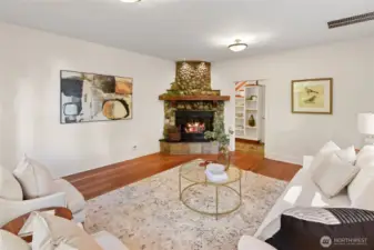 Living room features river rock fireplace - currently propane. Can convert to wood if desired
