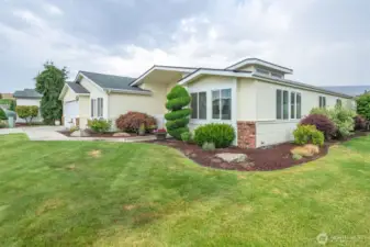 Brick wainscot siding, manicured landscape and beautiful architecture set this home apart!