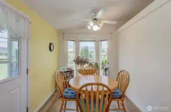Bay windows in Morning Room provide a wonderful space to nurture the green thumb...and the door leads to the covered patio!