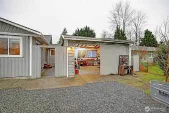 Generous detached garage w/benches and plenty of room for tools
