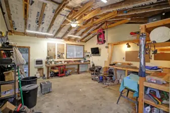 Interior of detached garage lots of benches and work space