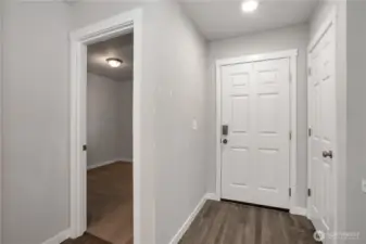 entry with coat closet and front bedroom