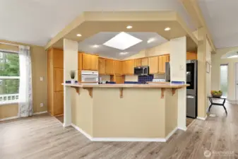 Open, easy living kitchen with a breakfast bar and ample storage