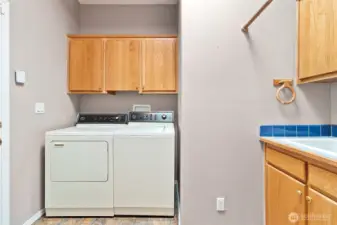 Very large utility room with a sink