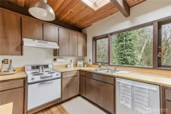 The kitchen window looks out onto the wooded ravine.