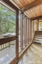 The front entry and the stairs leading to the bedroom level.