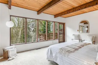 The primary bedroom with territorial views and a private balcony.