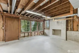 The unfinished basement with a fireplace provides ample opportunity for expansion.