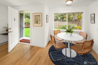 Looking back towards the front door, there is a sweet breakfast corner in addition to your proper dining space.