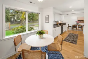 Looking from your sweet dining nook towards your bright kitchen.