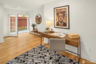 This space sits adjacent to your large dining area and could function great in SO many ways! The French doors lead to your side deck, leading to your large backyard.