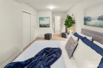 The main floor primary;e there is a closet on the left and the door at the back of the room leads to a spacious attached bathroom.