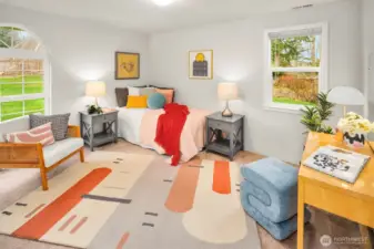 The third bedroom lives on the main floor in the southeast corner, with great space and light!